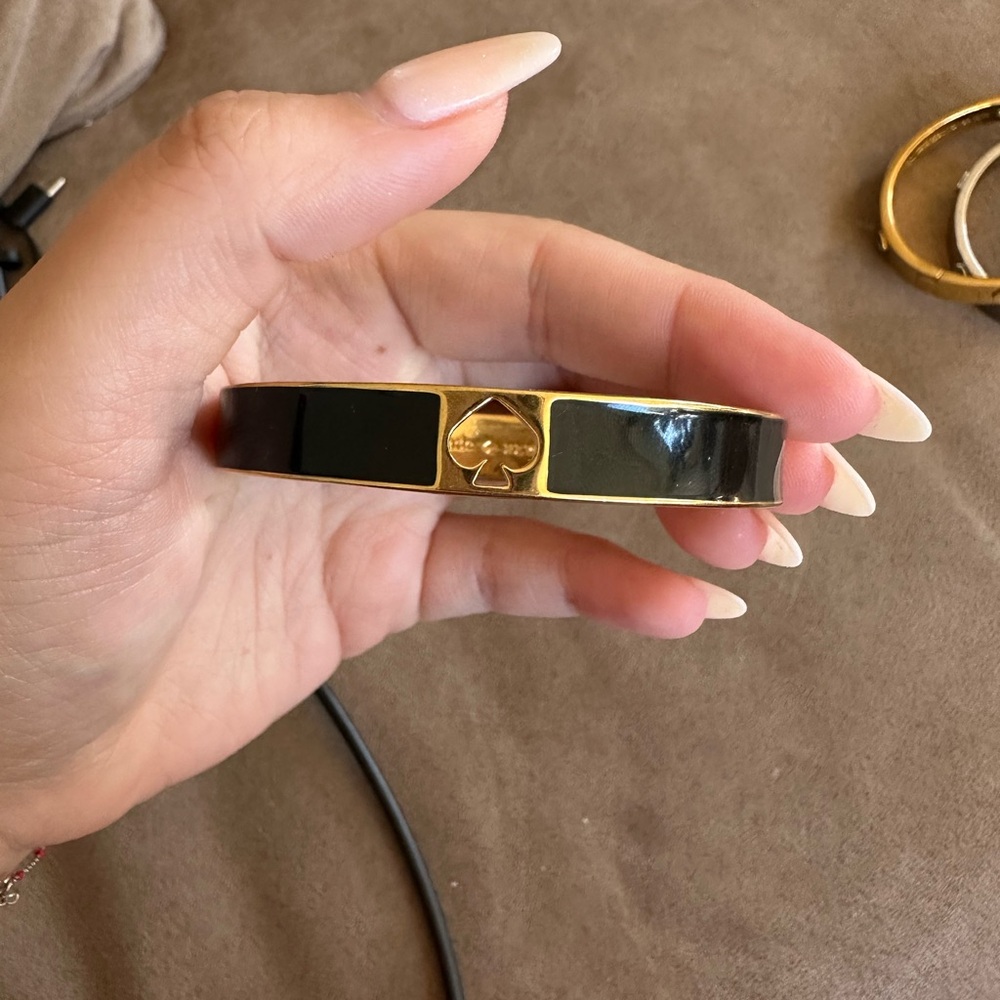 Kate Spade black enamel hole punch spade bangle